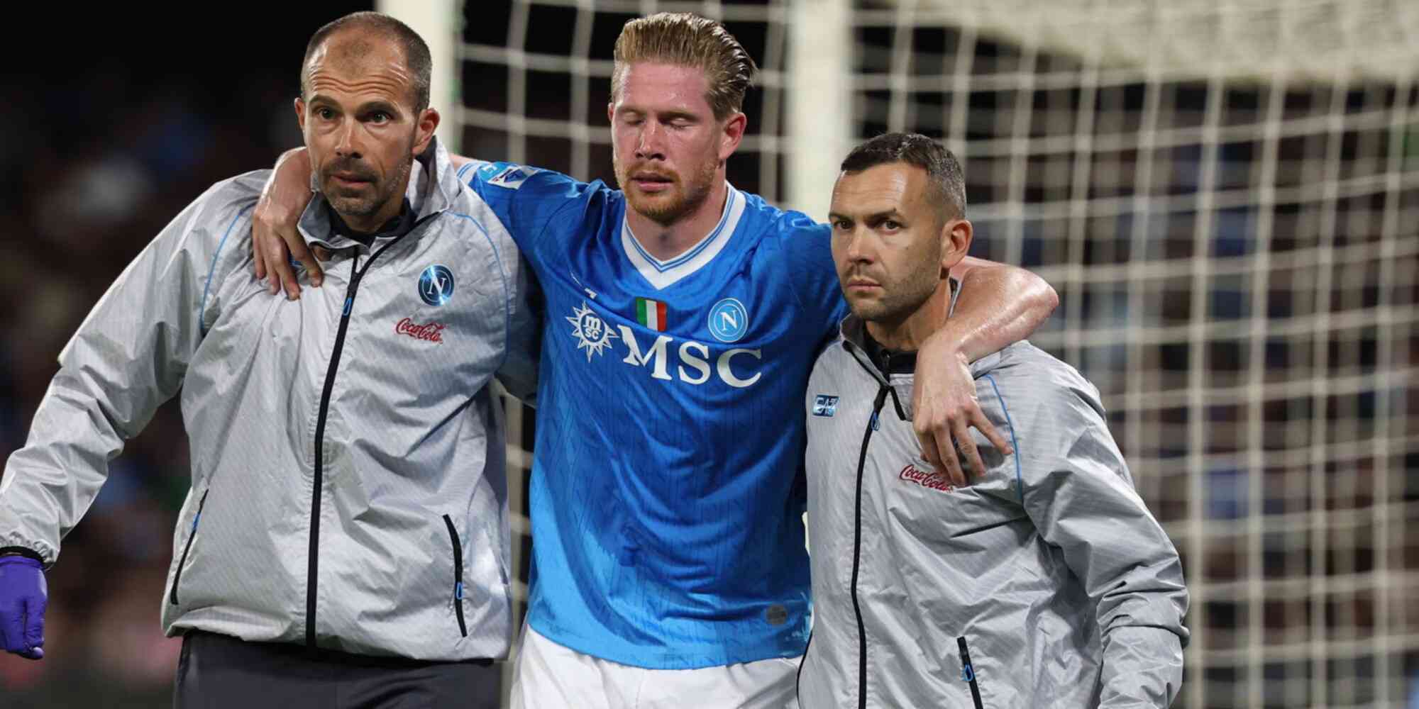 Kevin De Bruyne receiving help to leave the pitch after getting injured