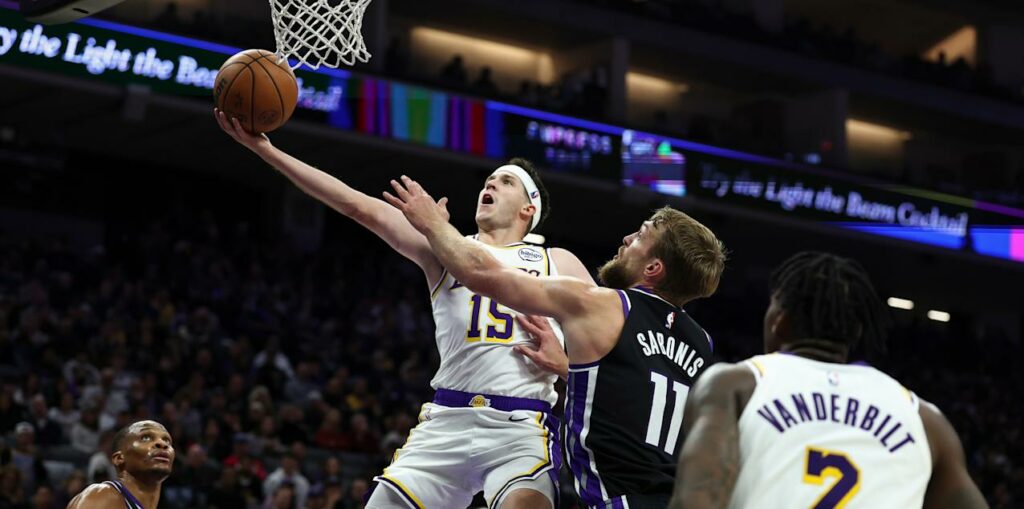 Austin Reaves with a lay-up in Sacramento Kings' basket