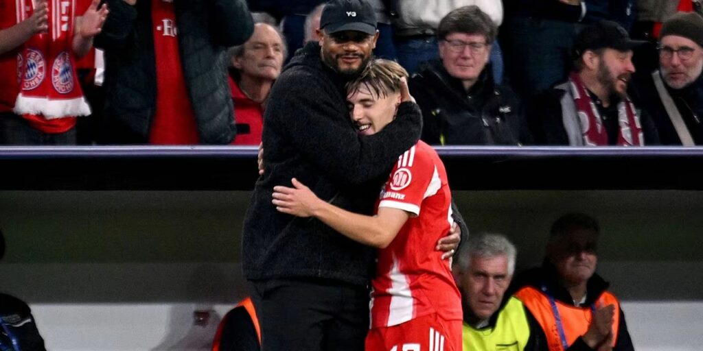 Vincent Kompany hugging Lennart Karl