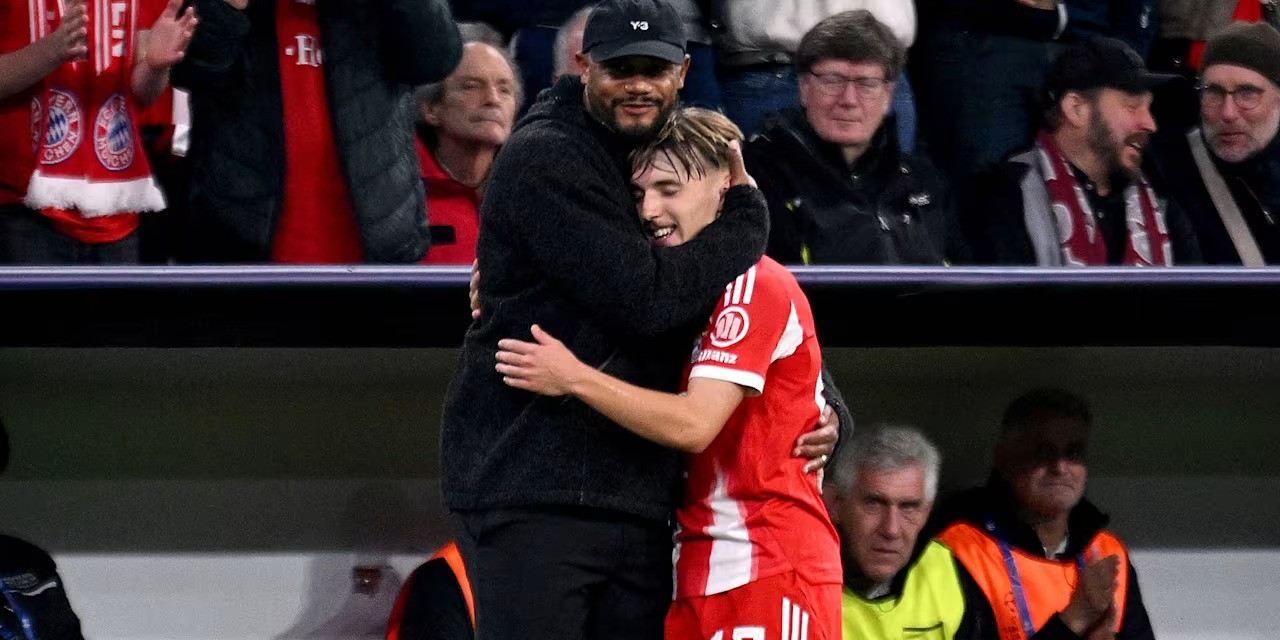 Vincent Kompany hugging Lennart Karl