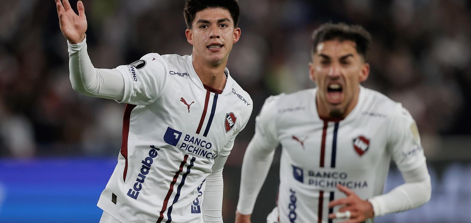 LDU Quito players celebrate after scoring against Palmeiras