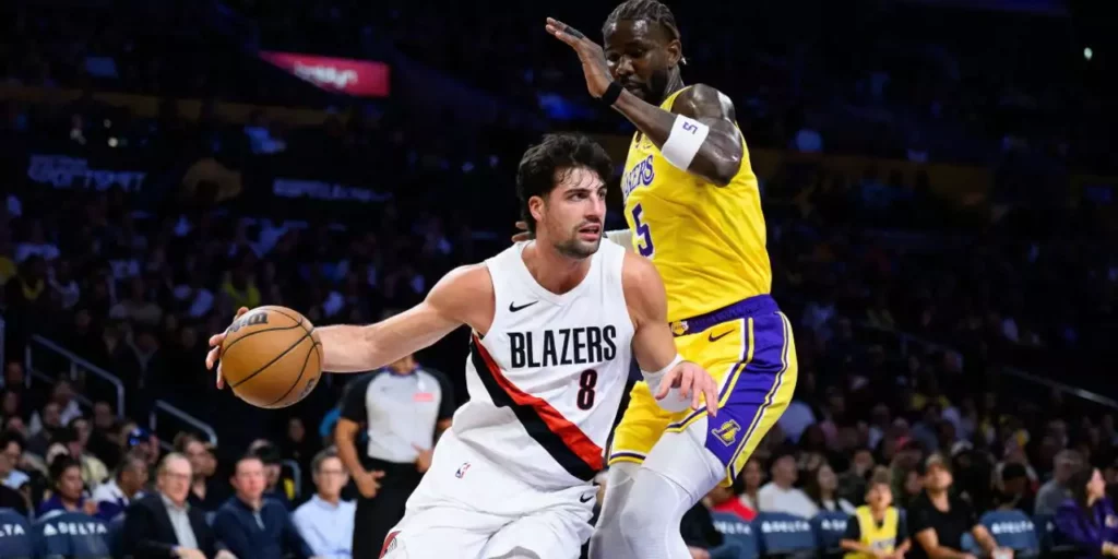 Deni Avdija guarded by Deandre Ayton