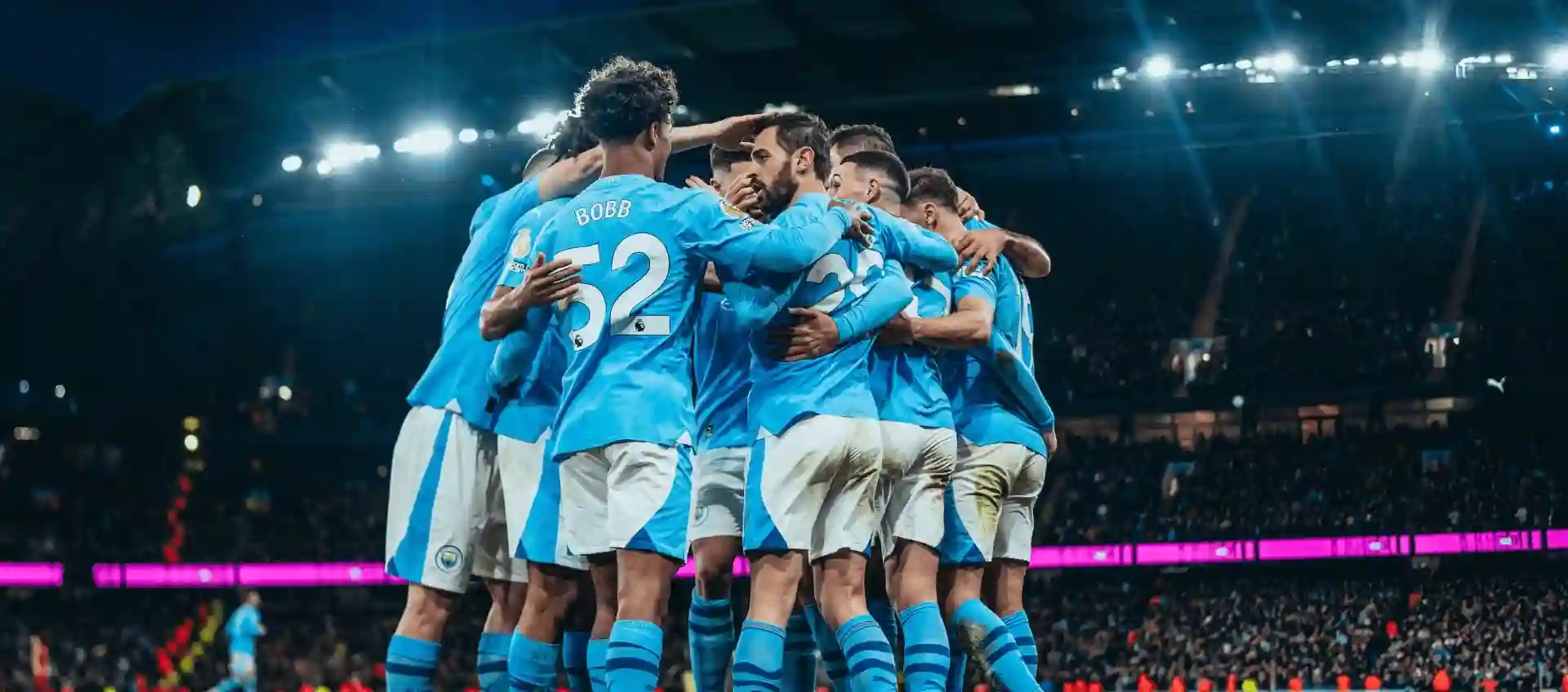 Manchester City players gathered in a circle