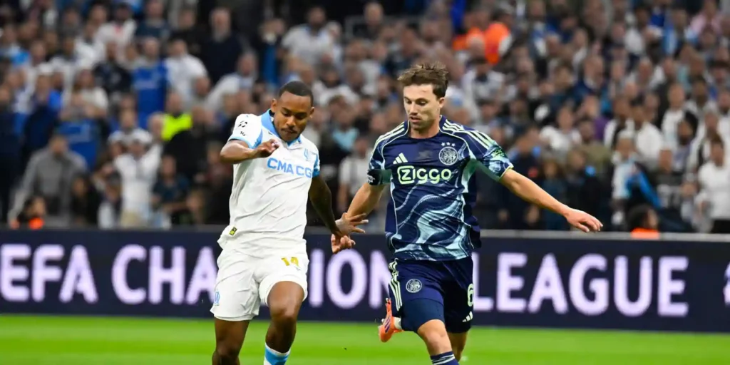 Marseille and Ajax players battle for the ball