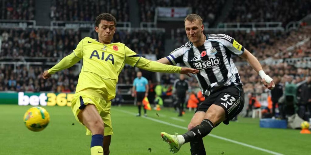 Newcastle player crosses the ball during the Carabao Cup clash with Tottenham