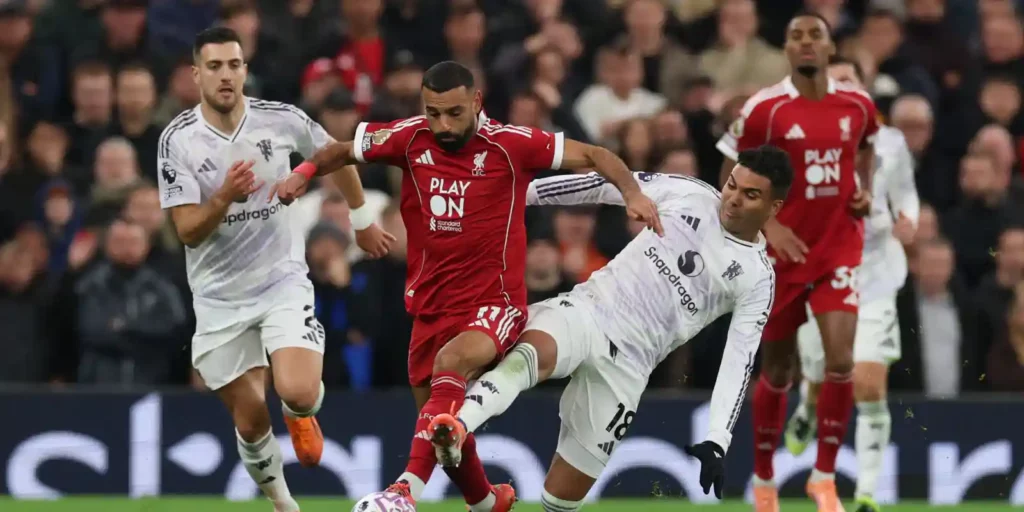 Mohamed Salah being tackled by Casemiro