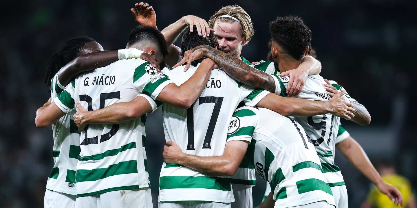 Sporting players celebrate after scoring a goal