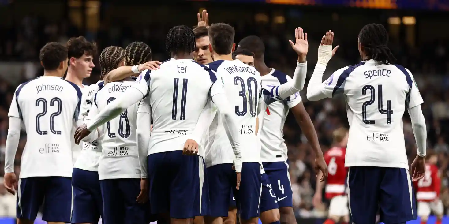 Tottenham players congratulate one another after scoring a goal