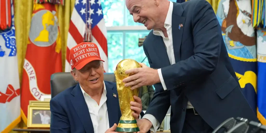 FIFA president Gianni Infantino showing Donald Trump the World Cup trophy