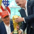 FIFA president Gianni Infantino showing Donald Trump the World Cup trophy