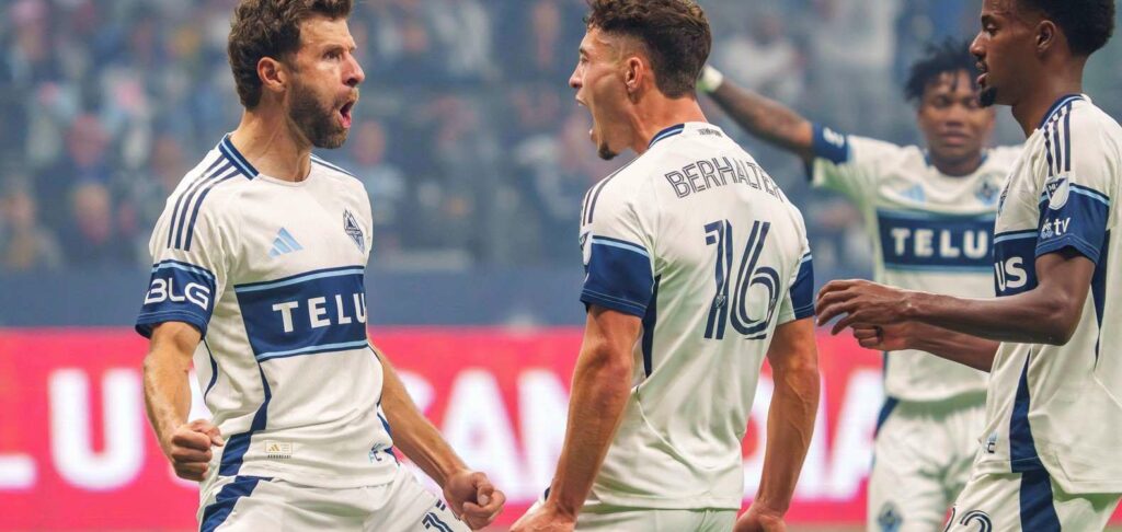 Thomas Muller celebrates with his Vancouver Whitecaps teammates after scoring a goal