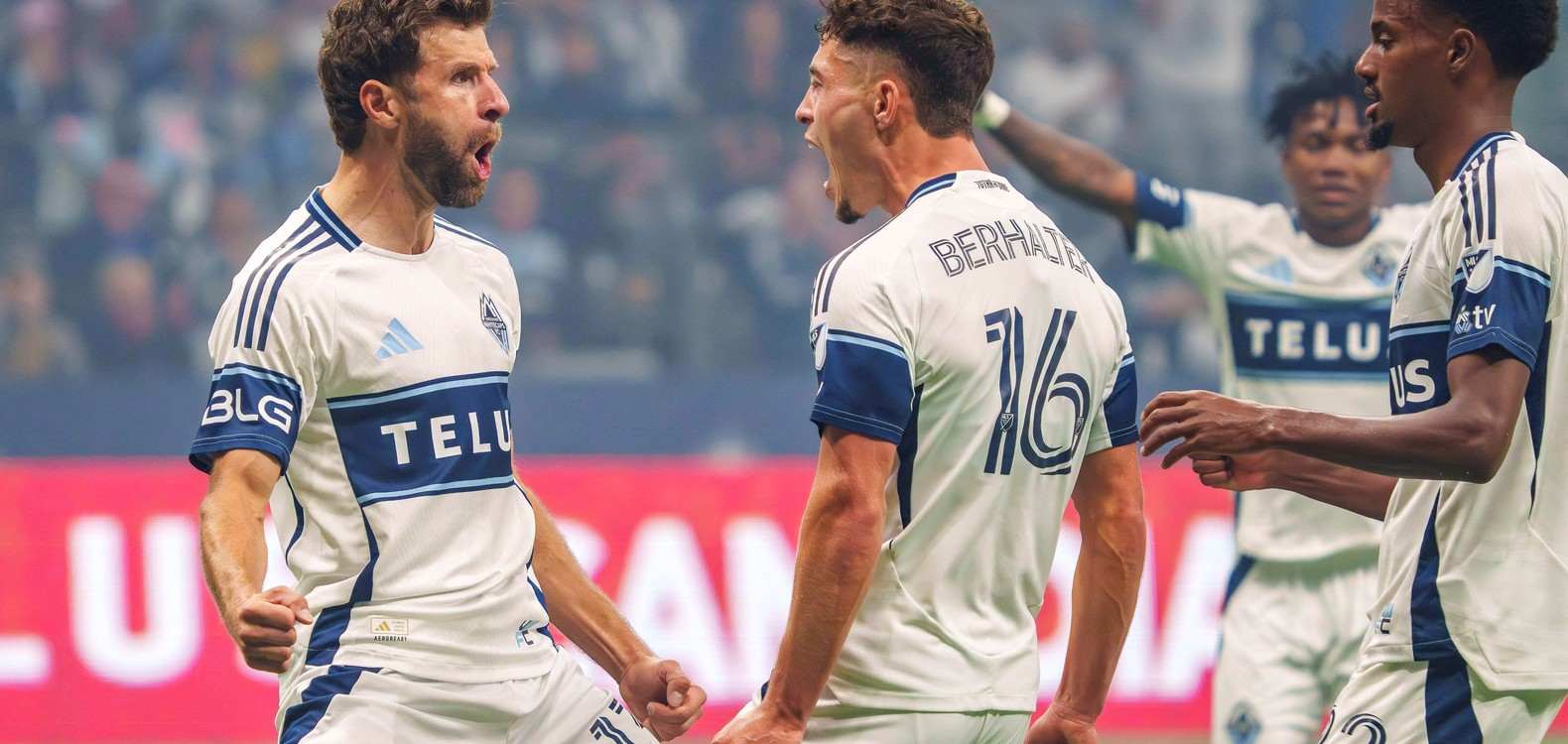 Thomas Muller celebrates with his Vancouver Whitecaps teammates after scoring a goal