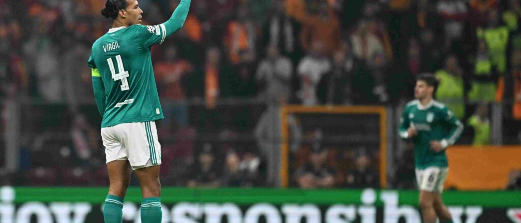 Virgil Van Dijk waves at his teammates during the match against Galatasaray