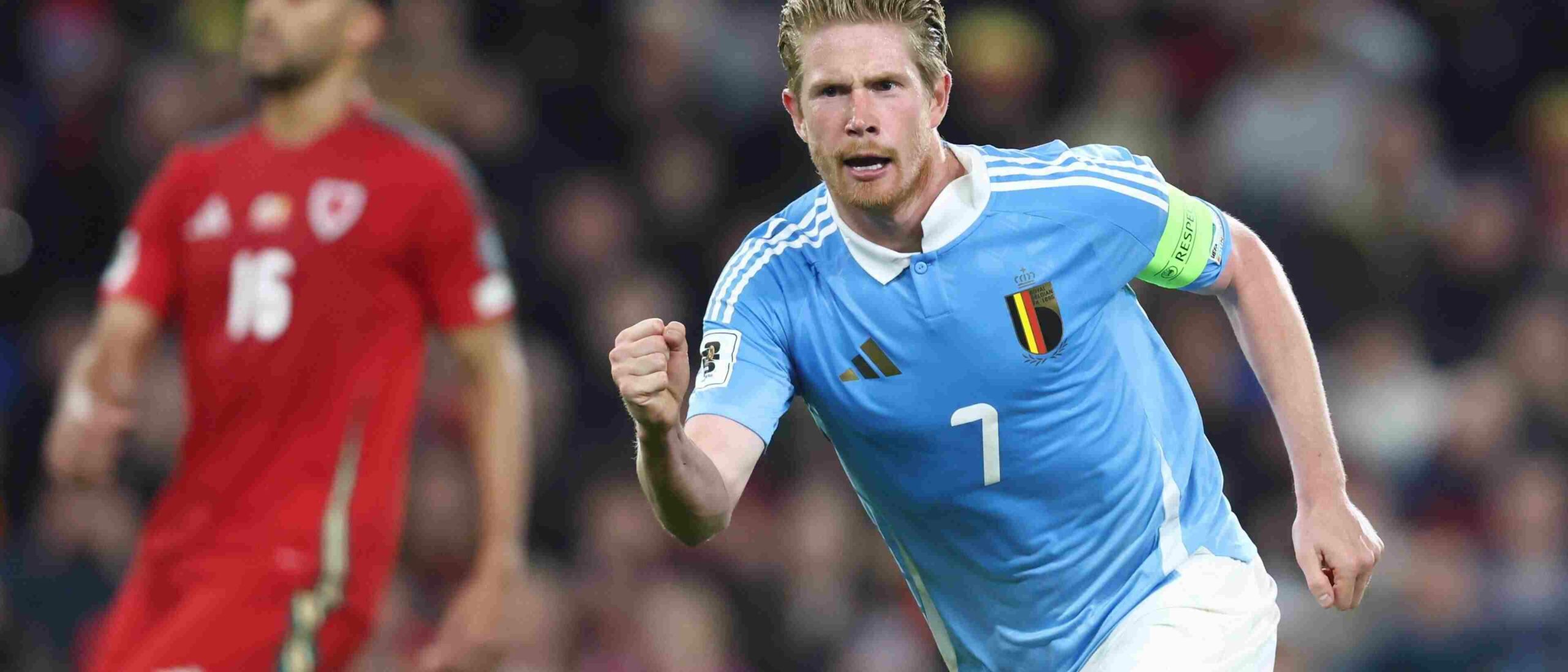 Kevin de Bruyne runs to celebrate after scoring against Wales