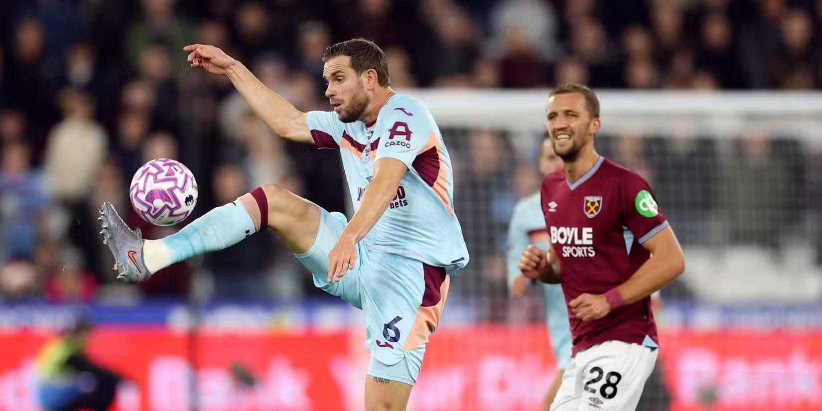 Jordan Henderson (Brentford) controls the ball in front of Tomas Soucek (West Ham)