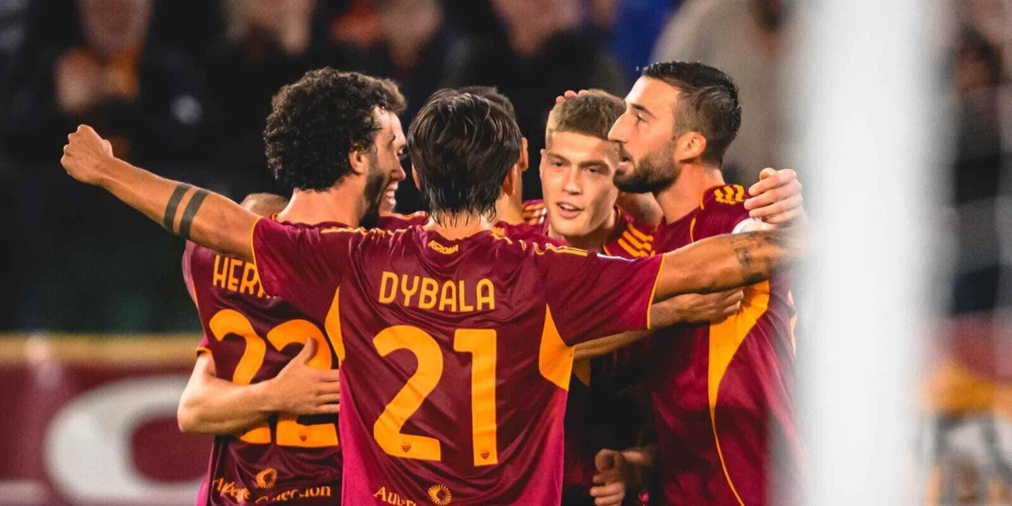 Roma players celebrate after scoring a goal