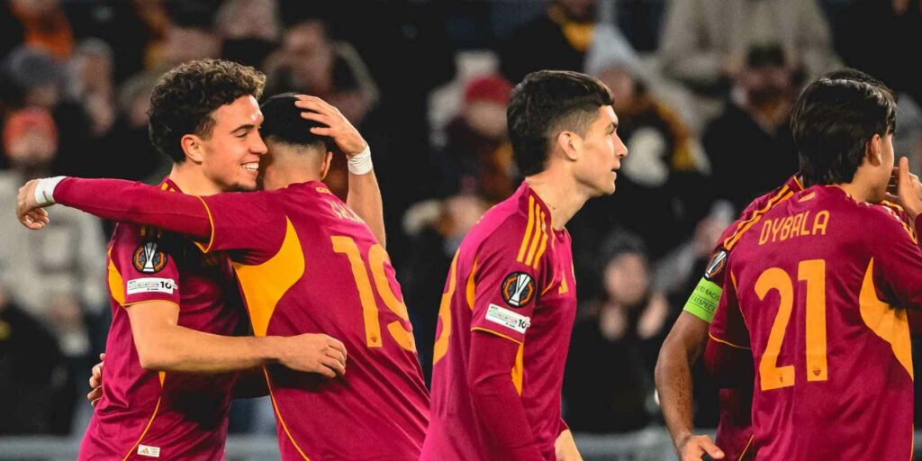 Roma players celebrate after scoring a goal