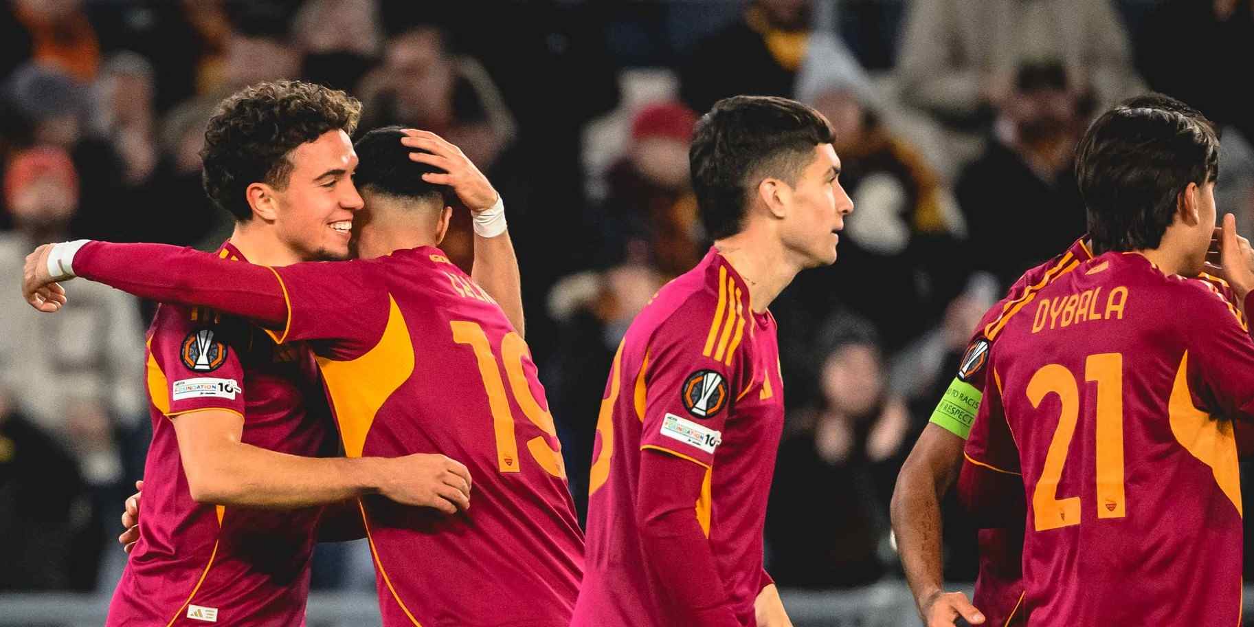 Roma players celebrate after scoring a goal