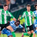 Betis and Utrecht players in a battle for the ball