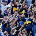 Exequiel Zeballos celebrates with the fans after scoring against River Plate