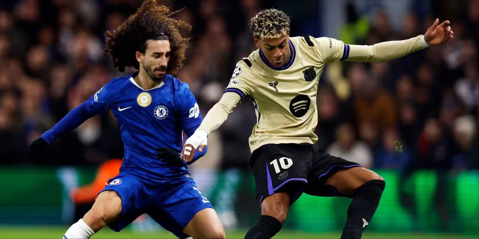 Marc Cucurella and Lamine Yamal in a battle for the ball