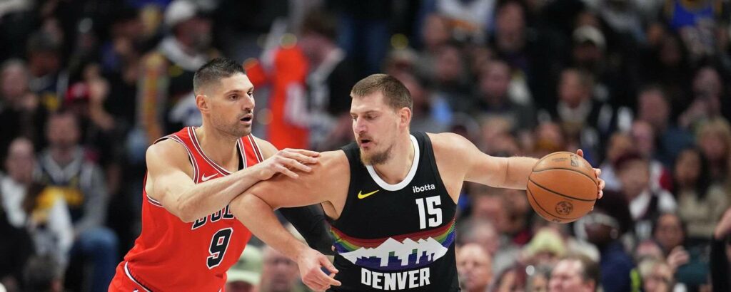 Nikola Vucevic guarding Nikola Jokic