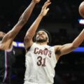 Jarrett Allen attempts to score despite the defence of Miami Heat player