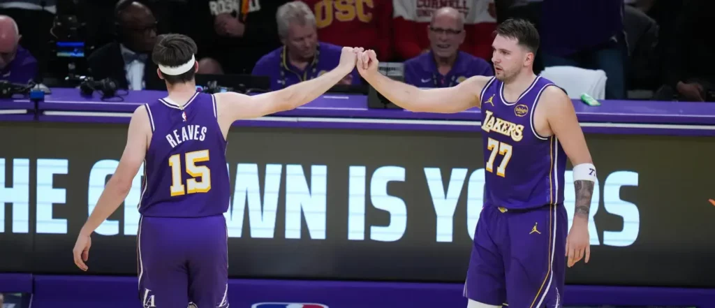 Luka Doncic and Austin Reaves congratulating each other