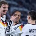 Nick Woltemade, Leroy Sane, and Florian Wirtz celebrate Germany's goal against Slovakia