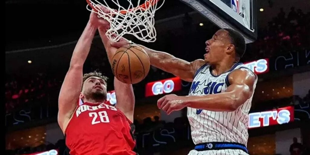 Alperen Sengun dunks in Orlando Magic's basket