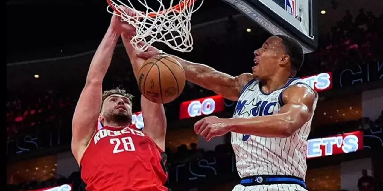 Alperen Sengun dunks in Orlando Magic's basket