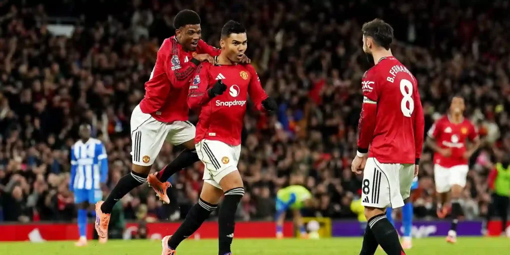 Casemiro, Amad, and Bruno Fernandes celebrate Manchester United goal