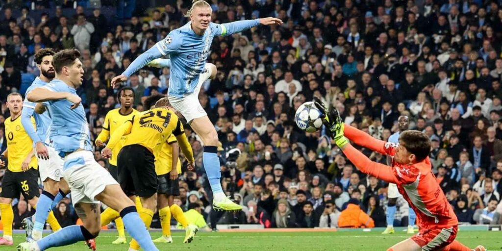 Erling Haaland sees his shot blocked by Borussia Dortmund goalkeeper