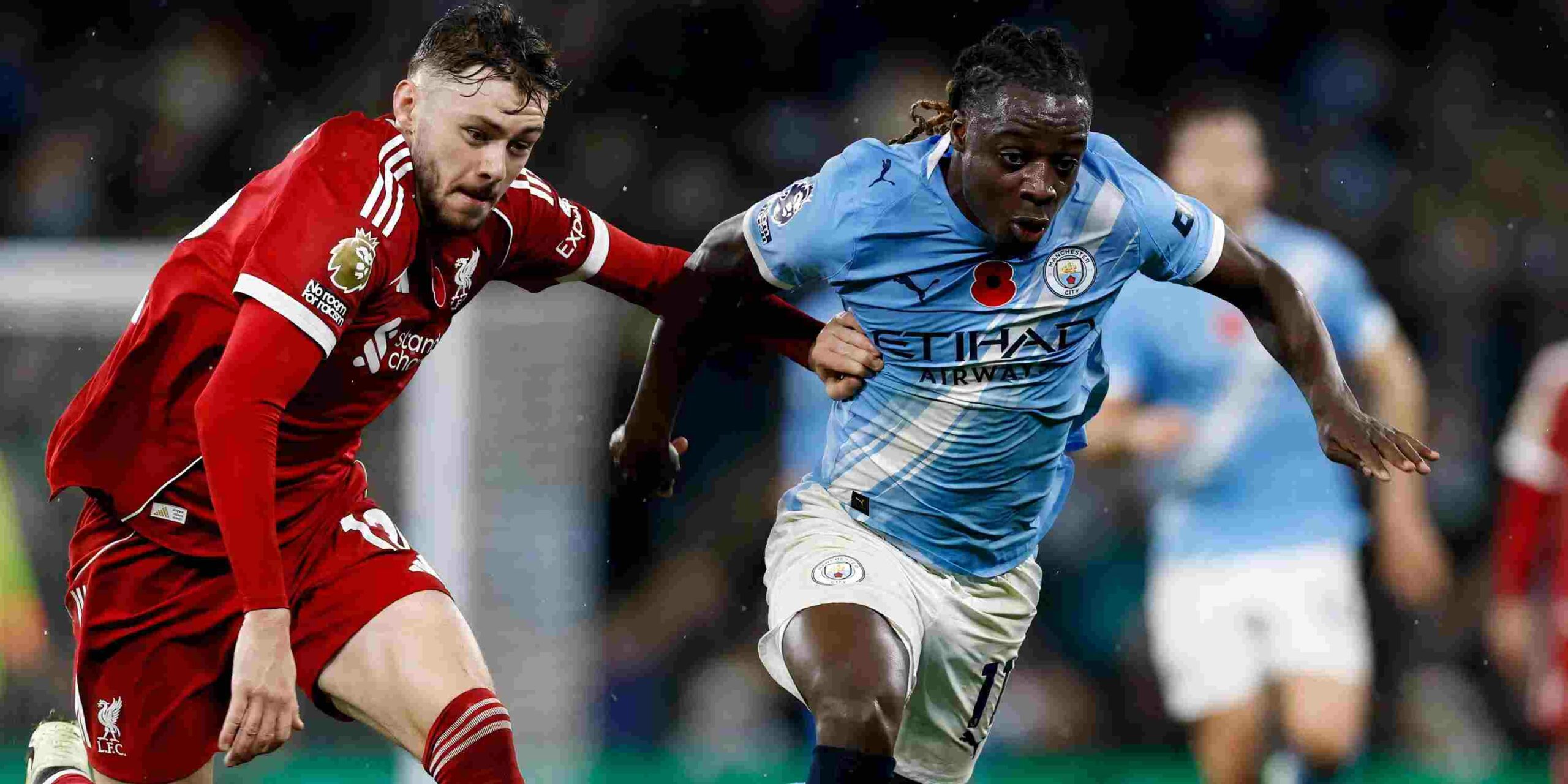 Jeremy Doku and Liverpool player in a battle for the ball