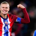 Erling Haaland smiling after scoring against Estonia