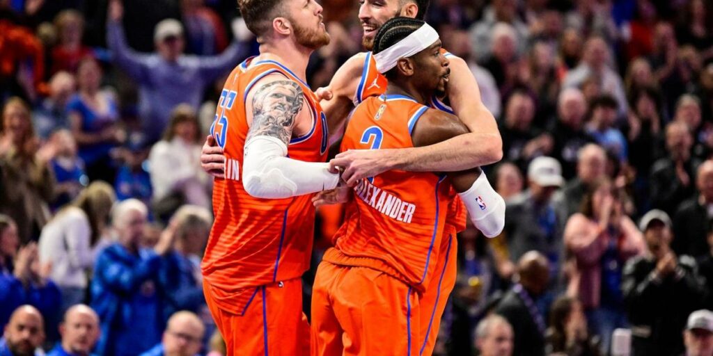 Oklahoma City Thunder players hugging one another