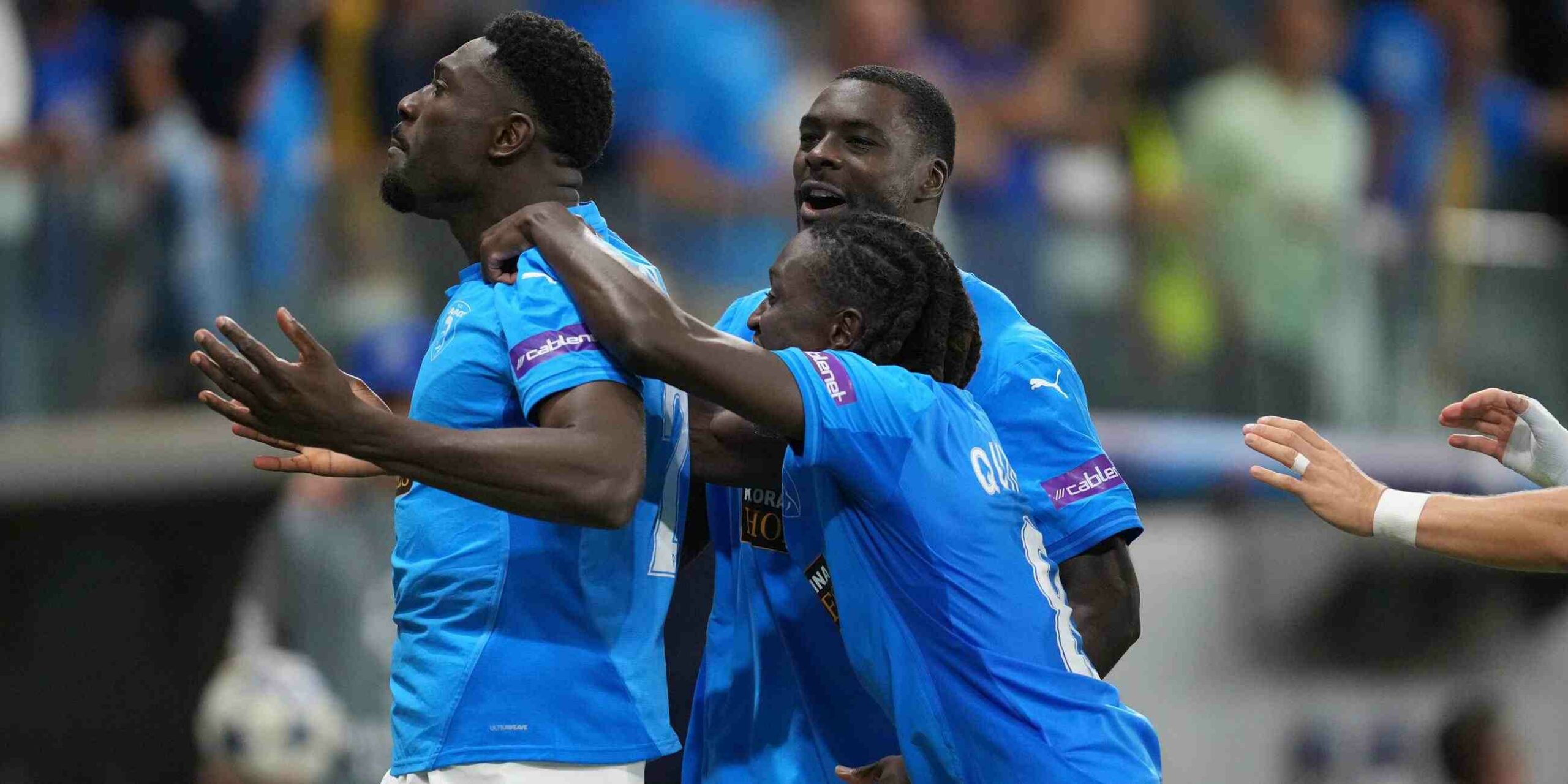 Pafos players rush to celebrate after scoring against Villarreal