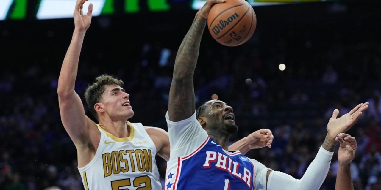 Andre Drummond attempts a dunk in Boston Celtics' basket
