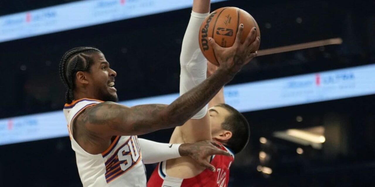 Jalen Green attacking Los Angeles Clippers basket despite Ivica Zubac's defence