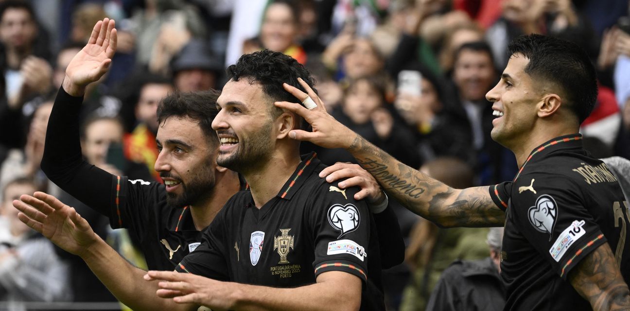 Concalo Ramos, Bruno Fernandes, and Joao Cancelo celebrate one of Portugal's goals against Armenia