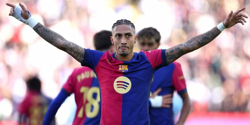 Raphinha celebrates after scoring for Barcelona