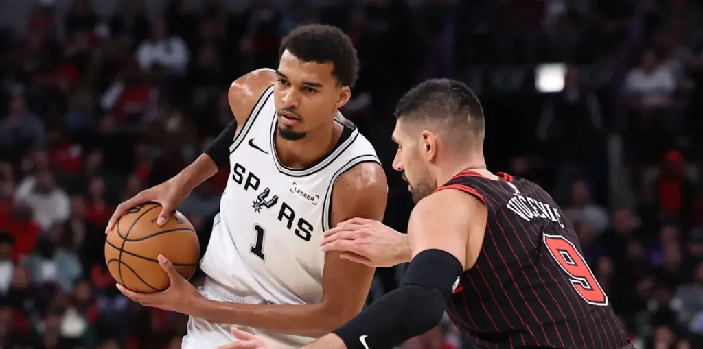 Victor Wembanyama guarded by Nikola Vucevic