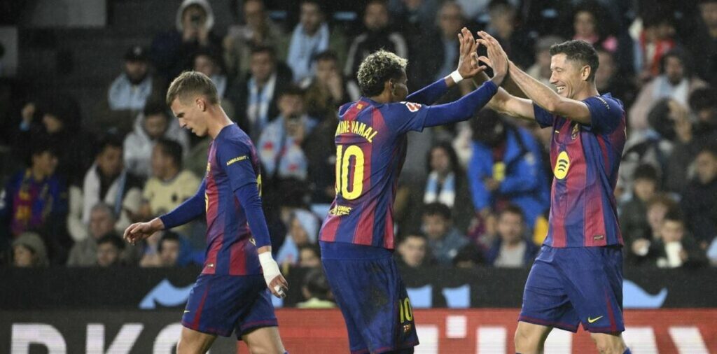 Lamine Yamal and Robert Lewandowski celebrate Barcelona goal against Celta Vigo