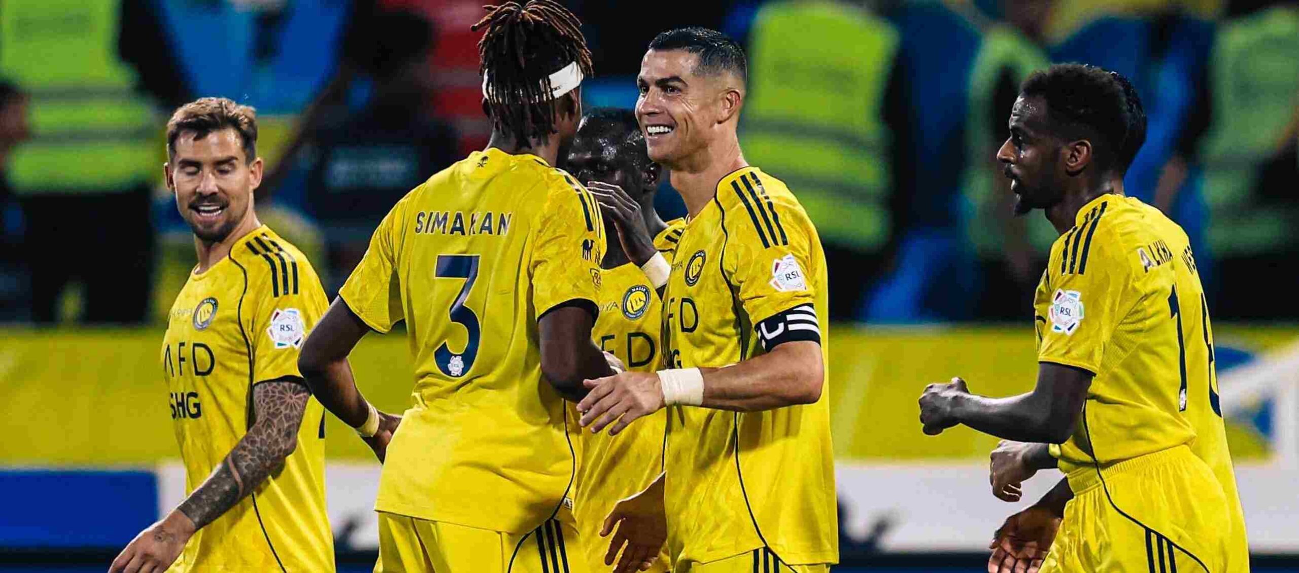 Al-Nassr players celebrate after scoring a goal