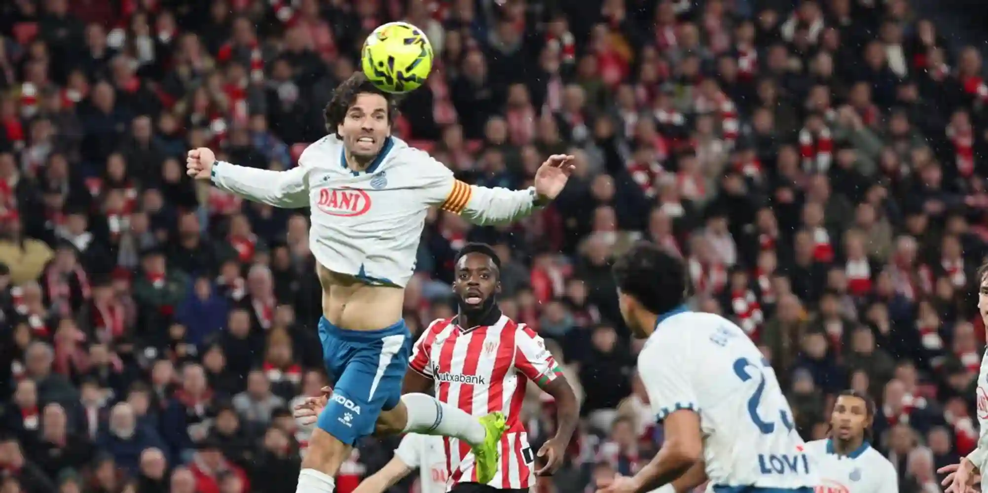 Espanyol player heads the ball during the match against Athletic Club