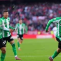 Betis players celebrate after scoring in the derby against Sevilla