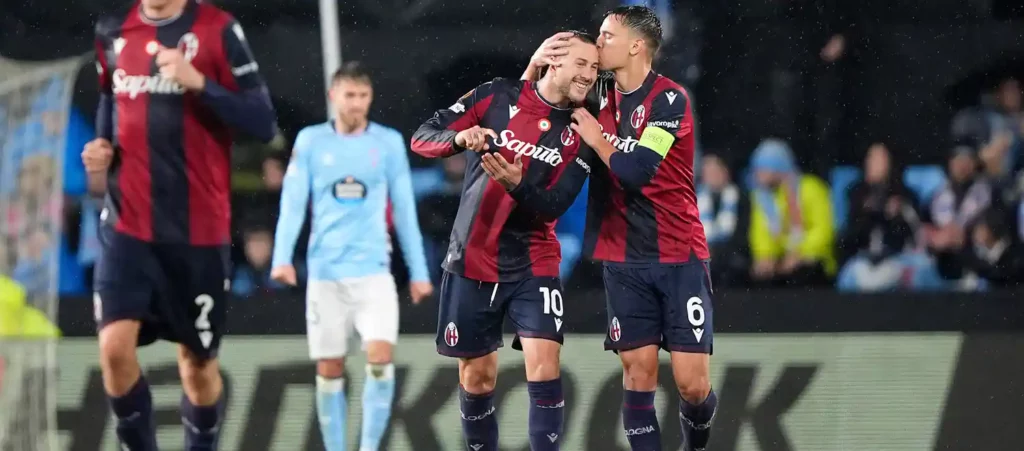 Bologna players celebrate after scoring against Celta