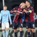 Bologna players celebrate after scoring against Celta