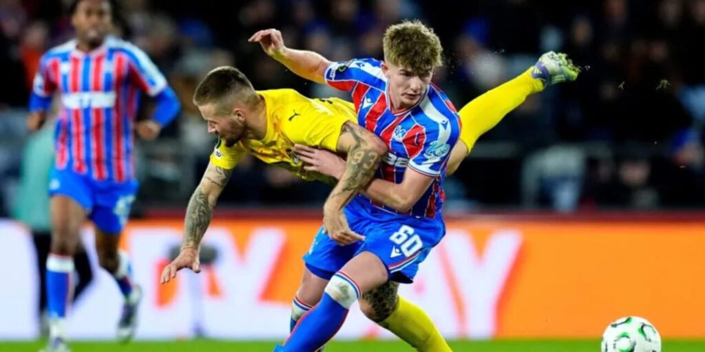 Crystal Palace and KuPS players in a ground duel