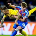 Crystal Palace and KuPS players in a ground duel